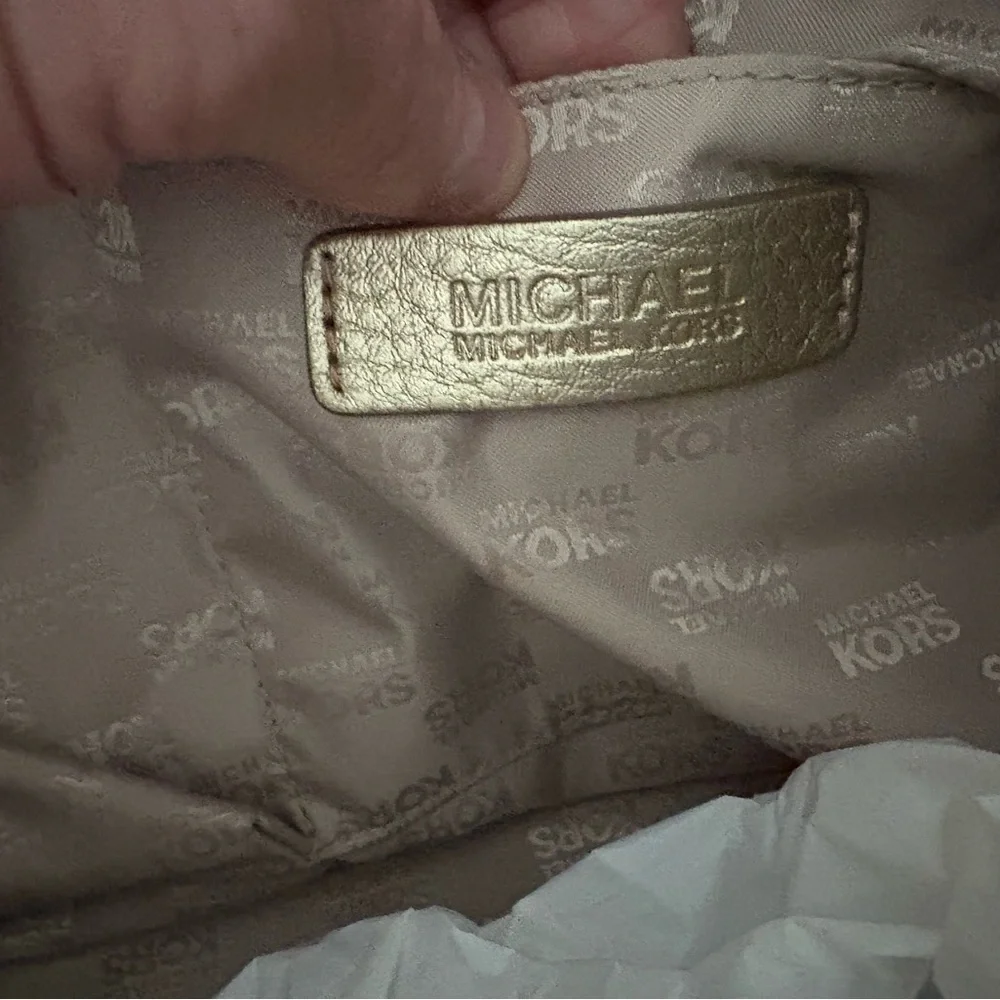 Michael Kors Tan Monogram Duffel Bag this is a womans duffle bag